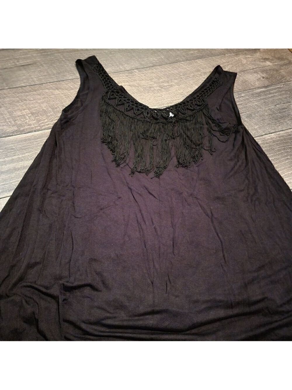 En Creme Sleeveless Tank with Crochet neckline and fringe.  Black.  Size LG